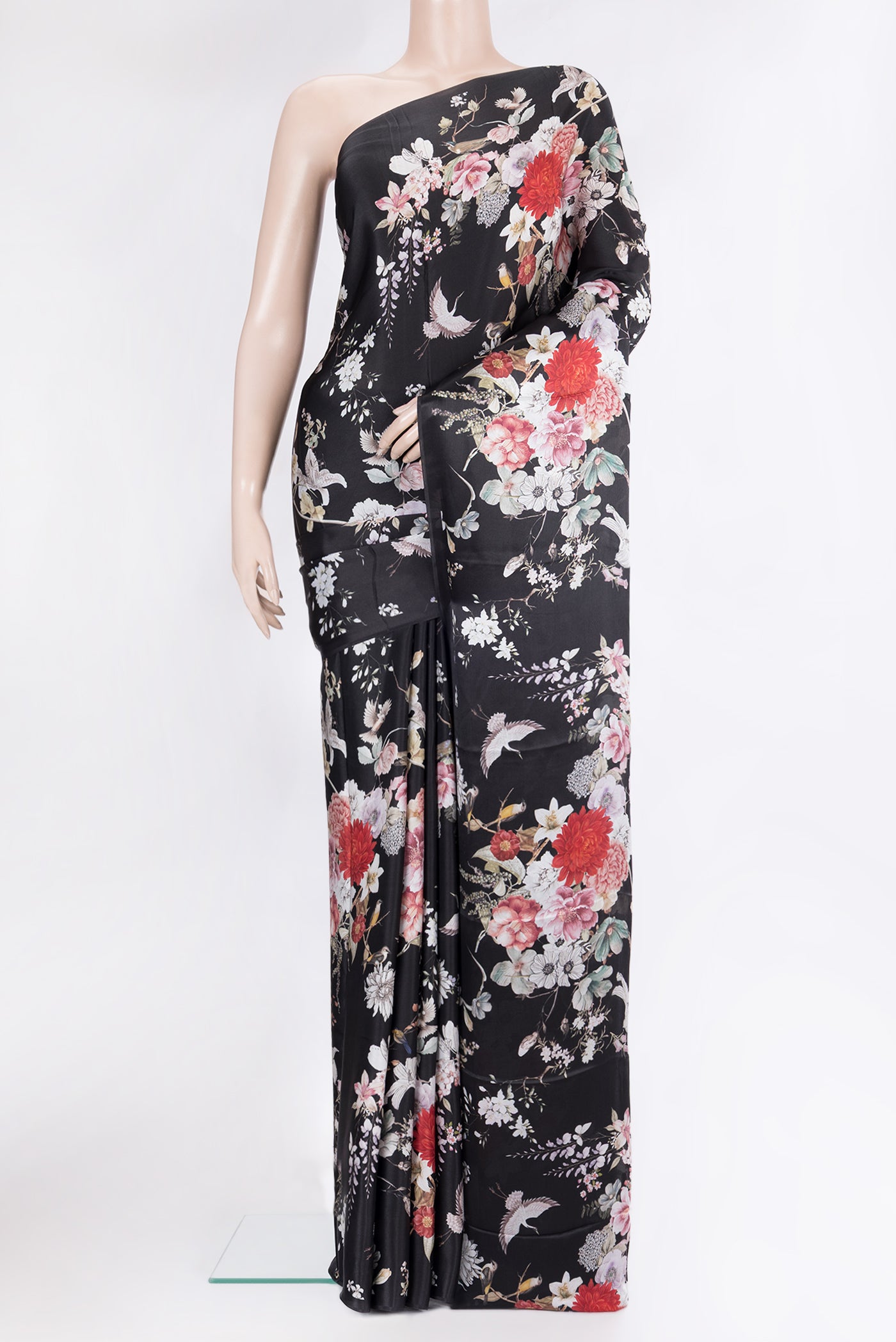 Black Crepe Saree with Printed design on the body and Without Border.  displayed on a mannequin