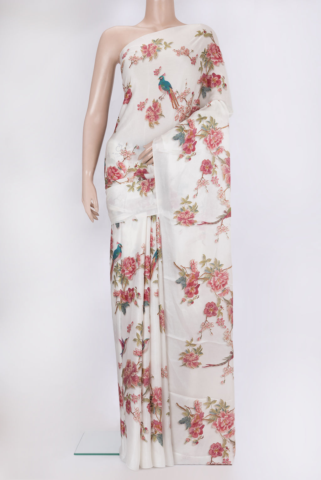 Off White Crepe Saree with Printed design on the body and Without Border.  displayed on a mannequin