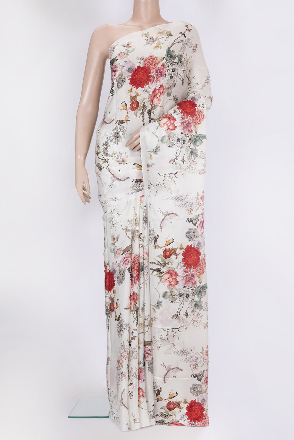 White Crepe Saree with Printed design on the body and Without Border.  displayed on a mannequin