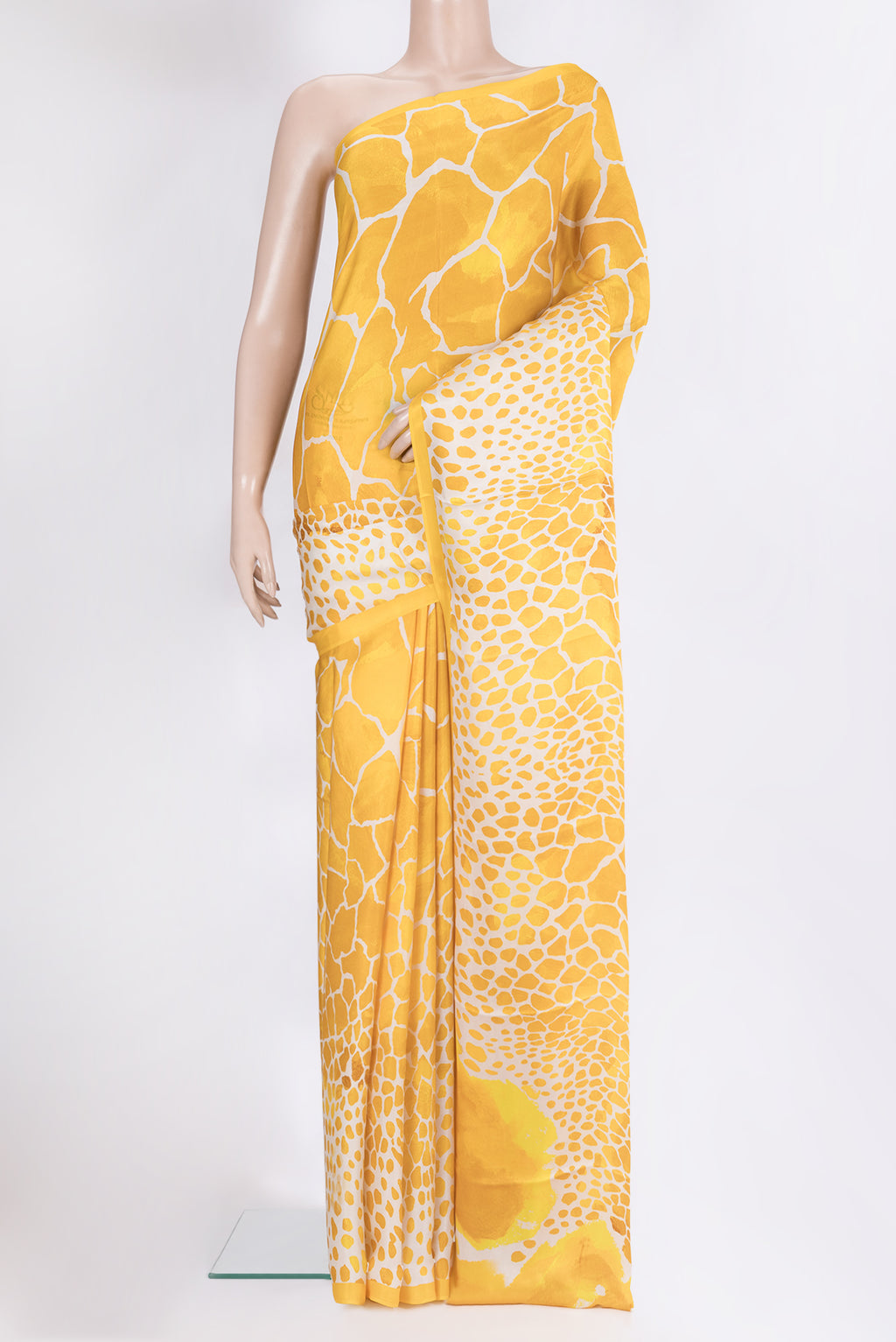 Yellow Crepe Saree with Printed design on the body and Without Border.  displayed on a mannequin