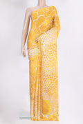 Yellow Crepe Saree with Printed design on the body and Without Border.  displayed on a mannequin