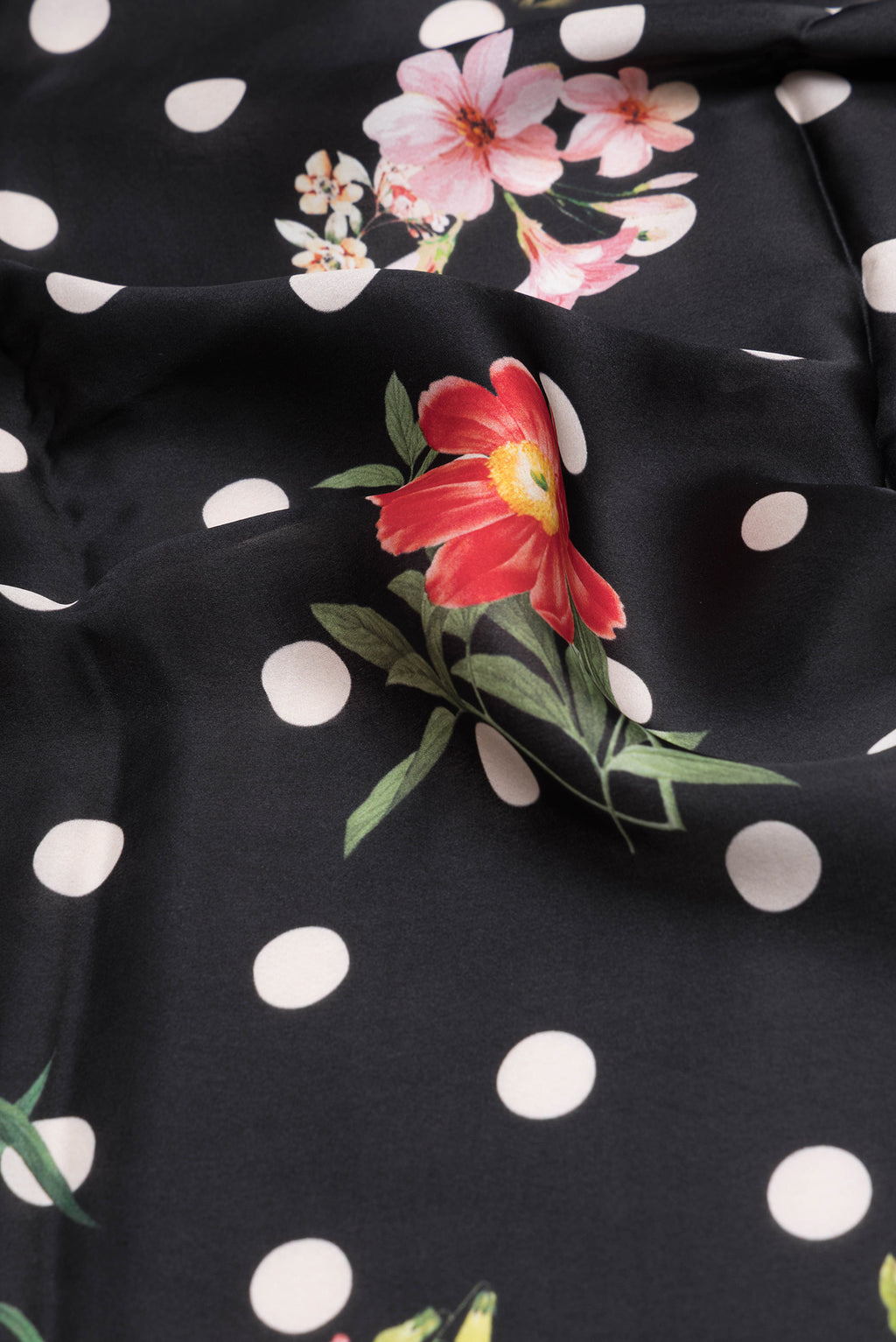 Close up of Black Crepe Saree with Printed design on the body and Without Border.  displaying folds