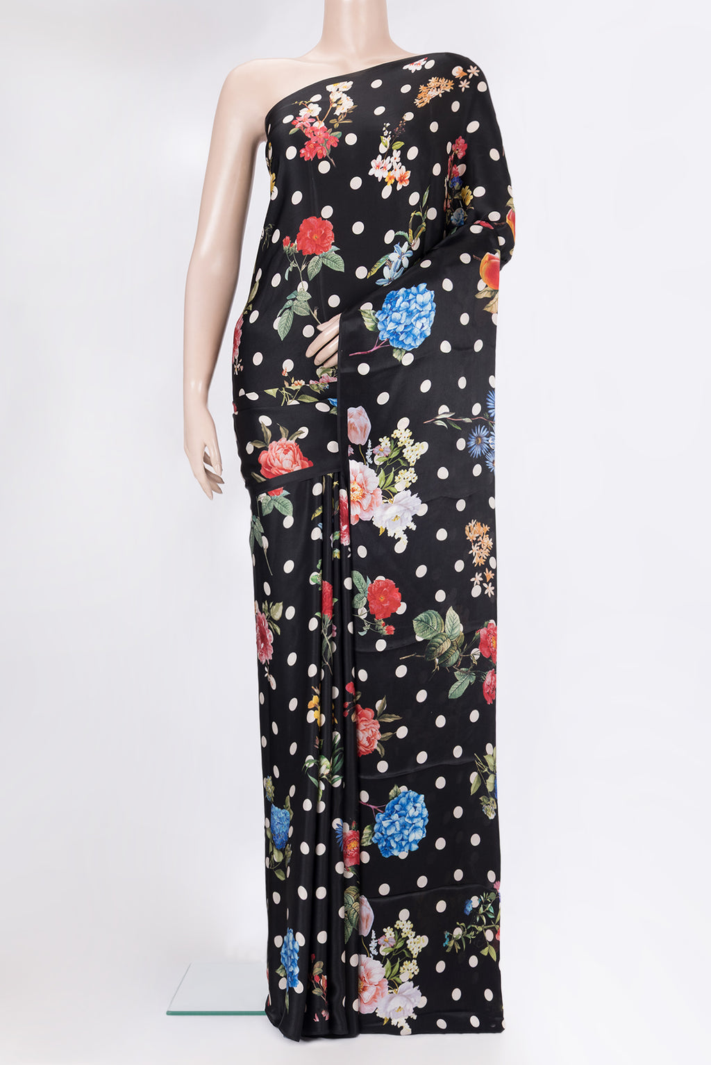 Black Crepe Saree with Printed design on the body and Without Border.  displayed on a mannequin