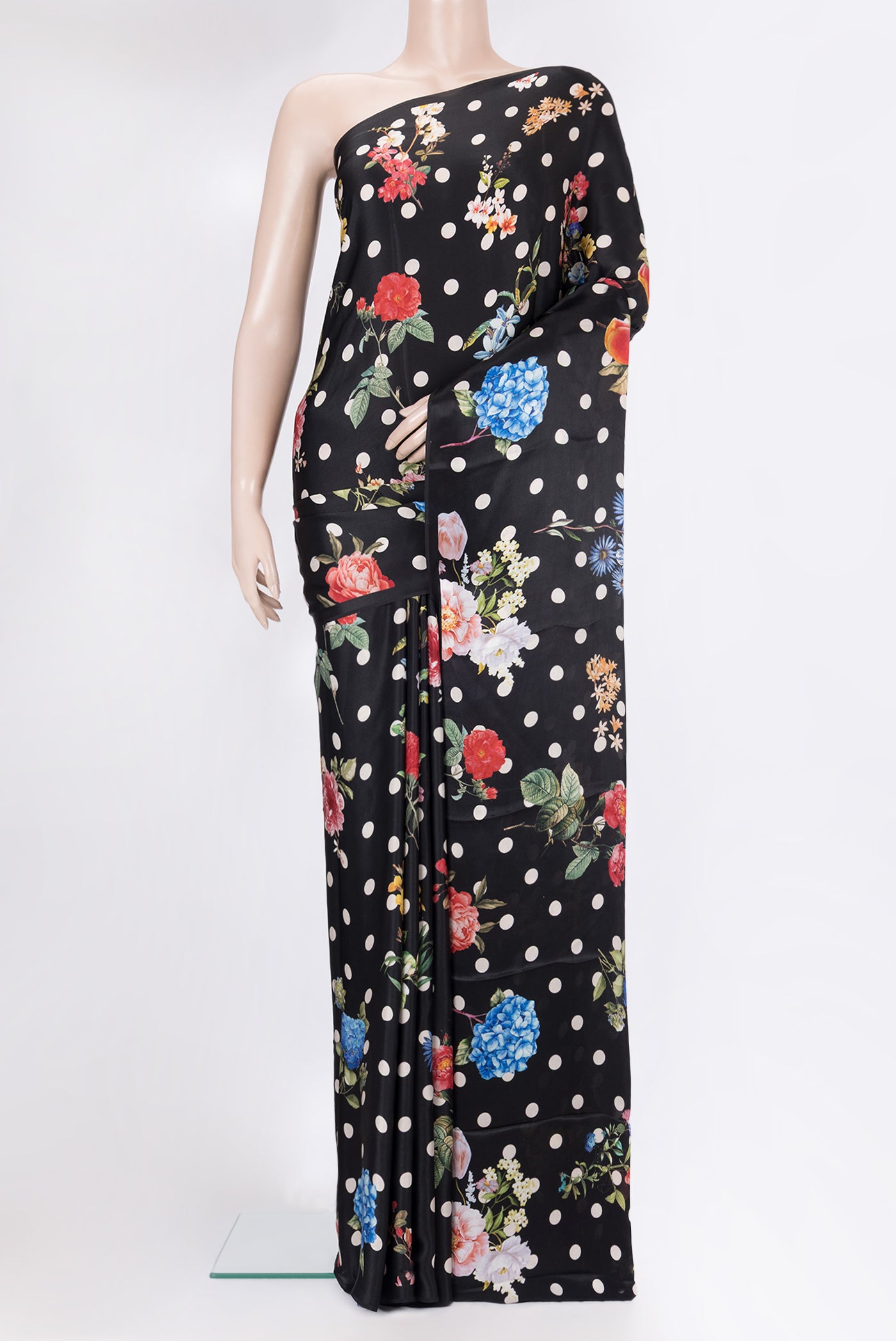 Black Crepe Saree with Printed design on the body and Without Border.  displayed on a mannequin