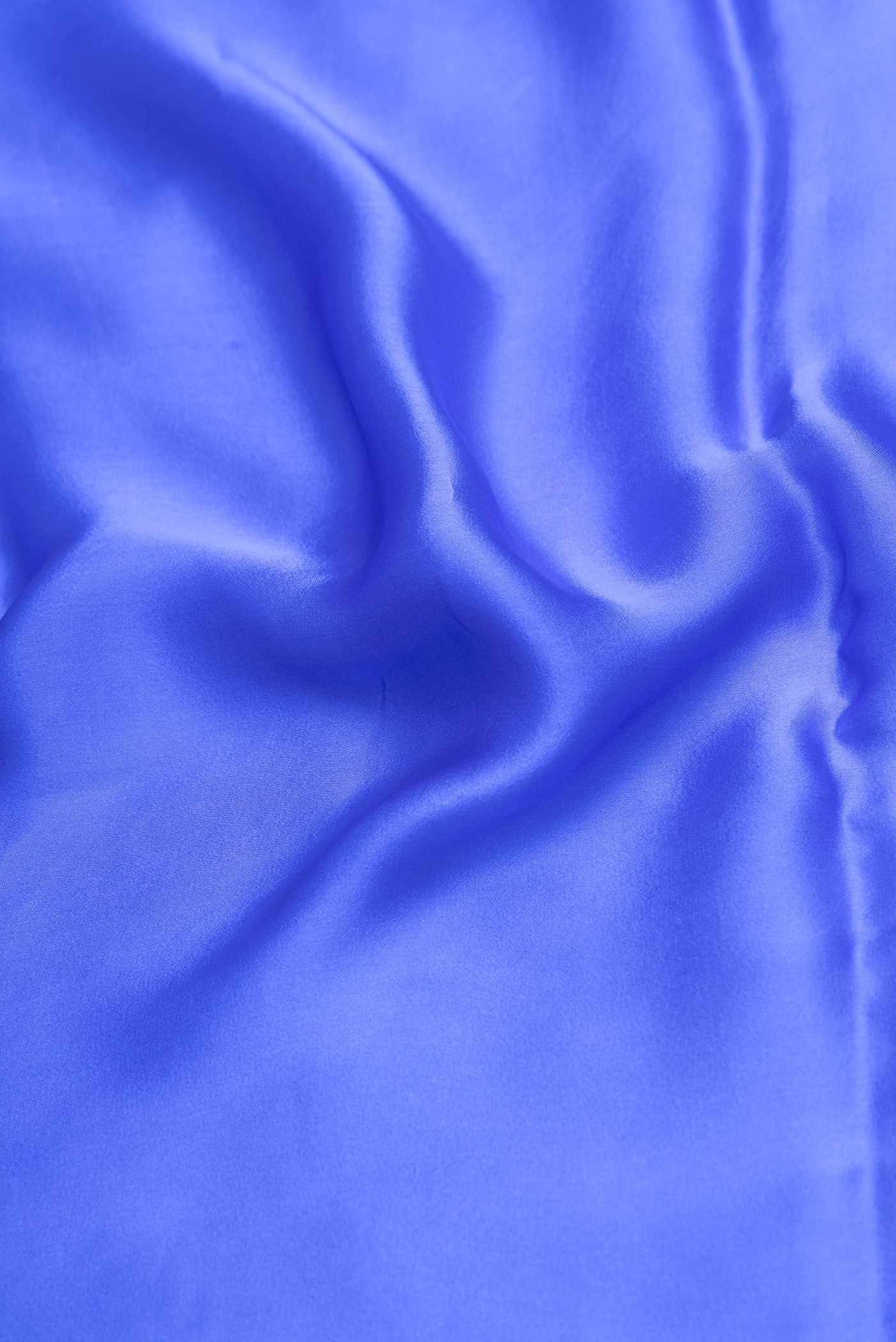Close up of Royal Blue Crepe Saree with Plain Body and Without Border.  displaying folds