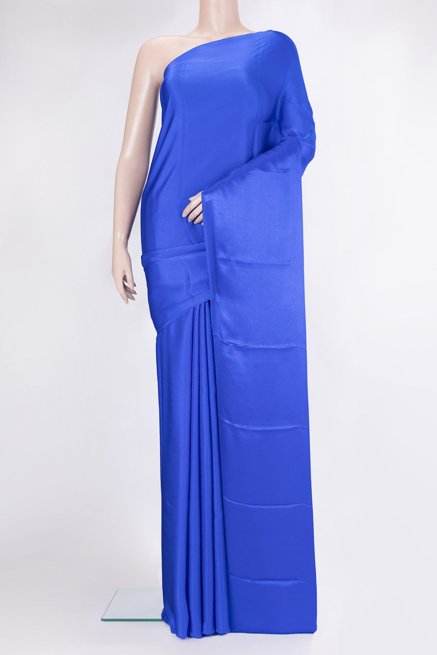 Royal Blue Crepe Saree with Plain Body and Without Border.  displayed on a mannequin
