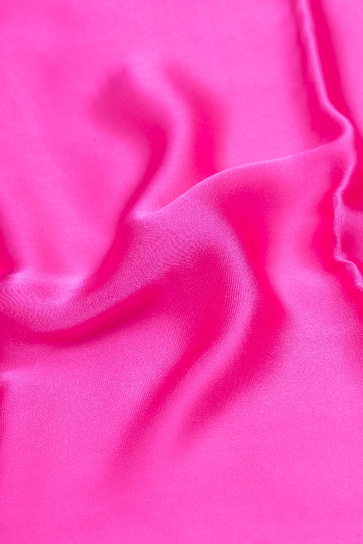 Close up of Dark Pink Crepe Saree with Plain Body and Without Border.  displaying folds