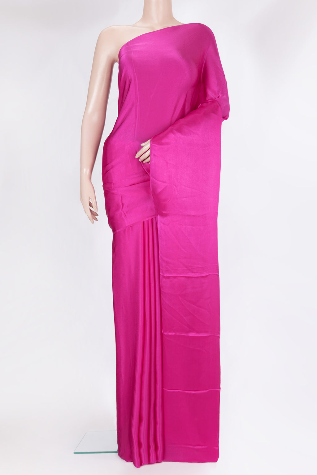 Dark Pink Crepe Saree with Plain Body and Without Border.  displayed on a mannequin
