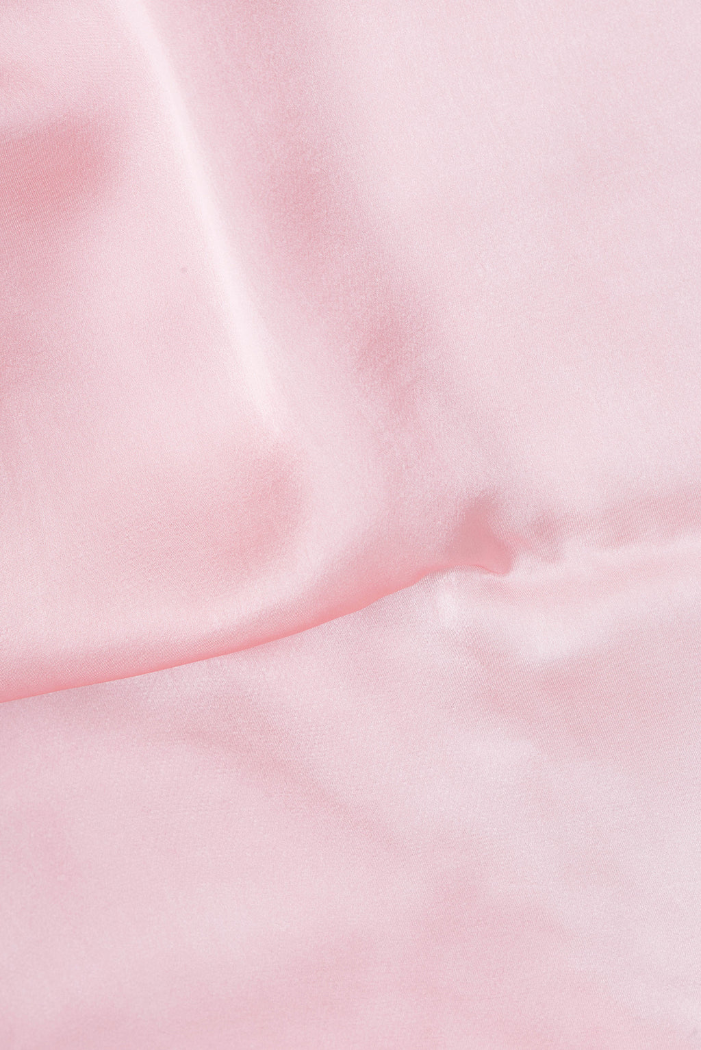 Close up of Rose pink Crepe Saree with Plain Body and Without Border.  displaying folds