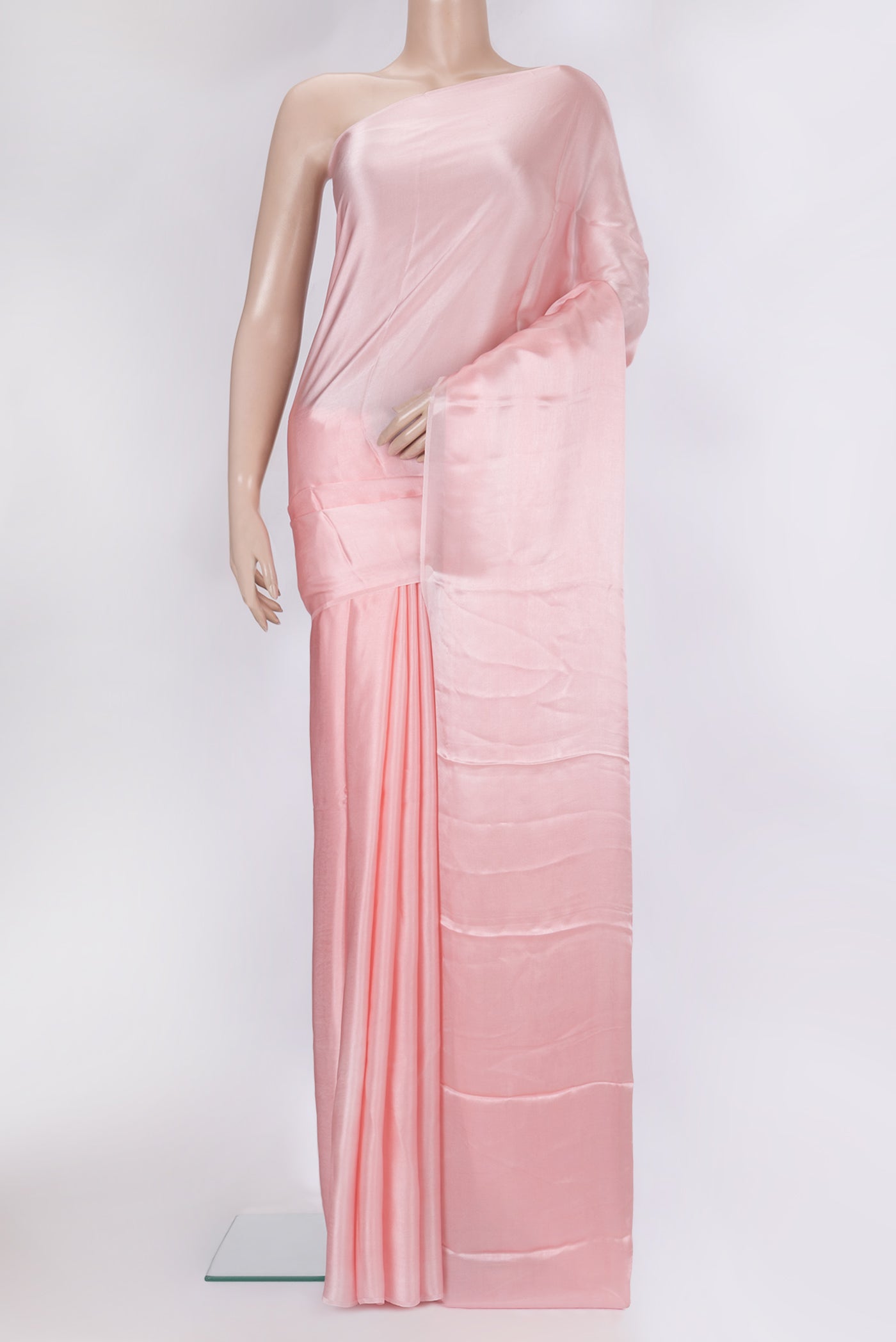 Rose pink Crepe Saree with Plain Body and Without Border.  displayed on a mannequin