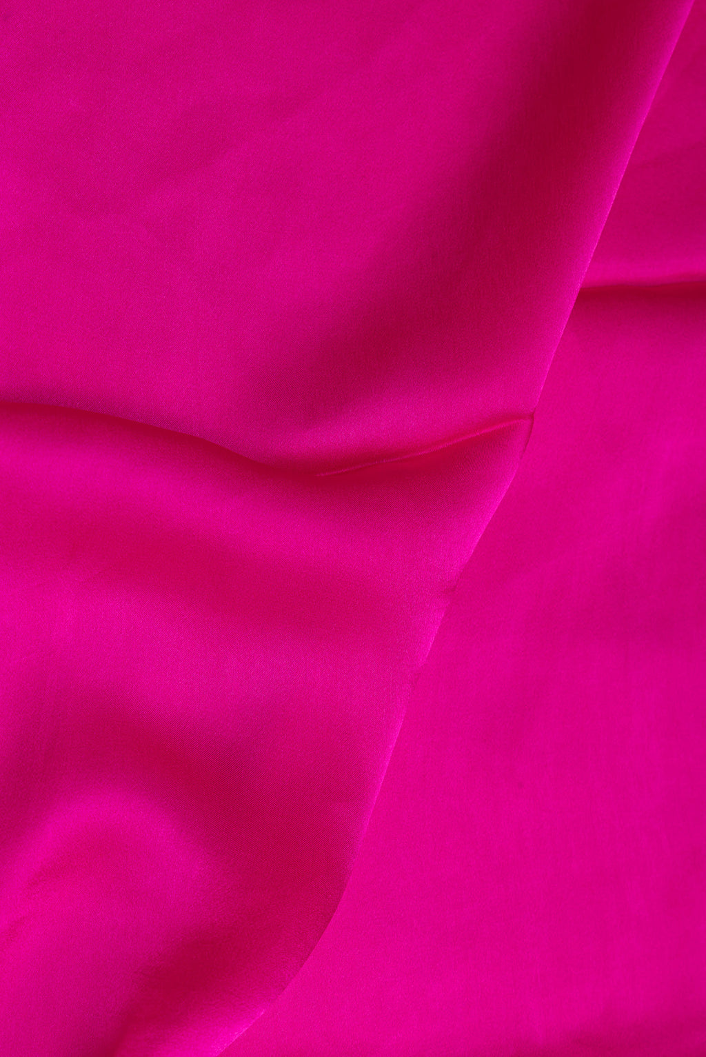 Close up of Dark Pink Crepe Saree with Plain Body and Without Border.  displaying folds