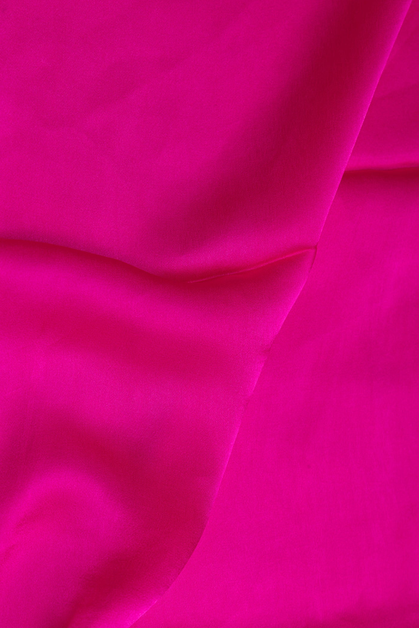 Close up of Dark Pink Crepe Saree with Plain Body and Without Border.  displaying folds