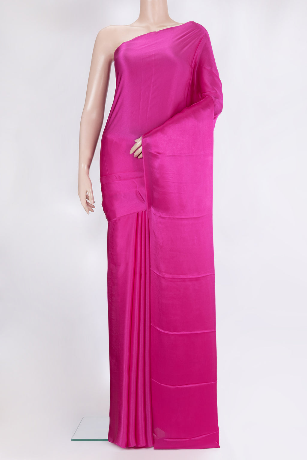 Dark Pink Crepe Saree with Plain Body and Without Border.  displayed on a mannequin