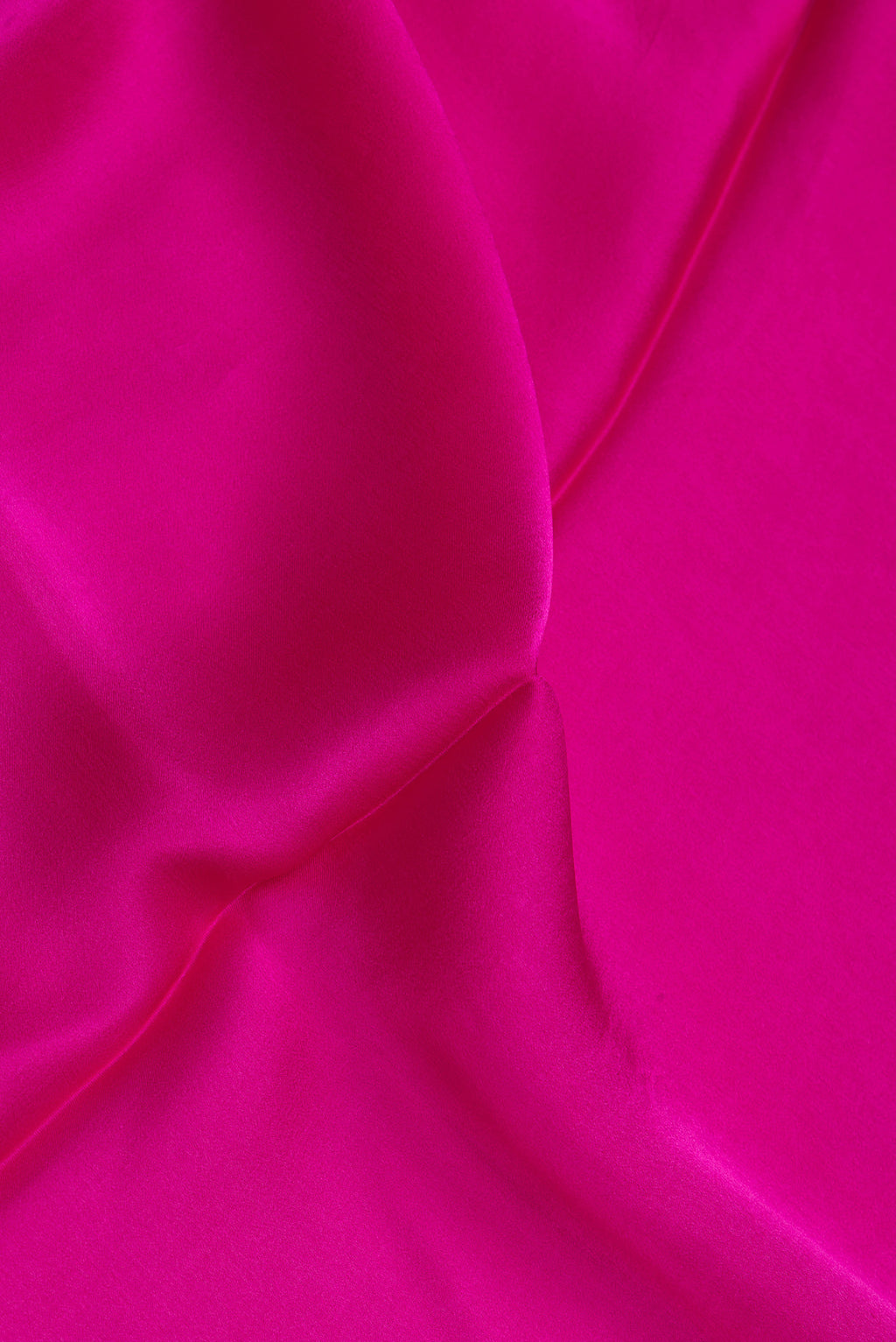 Close up of Dark Pink Crepe Saree with Plain Body and Without Border.  displaying folds