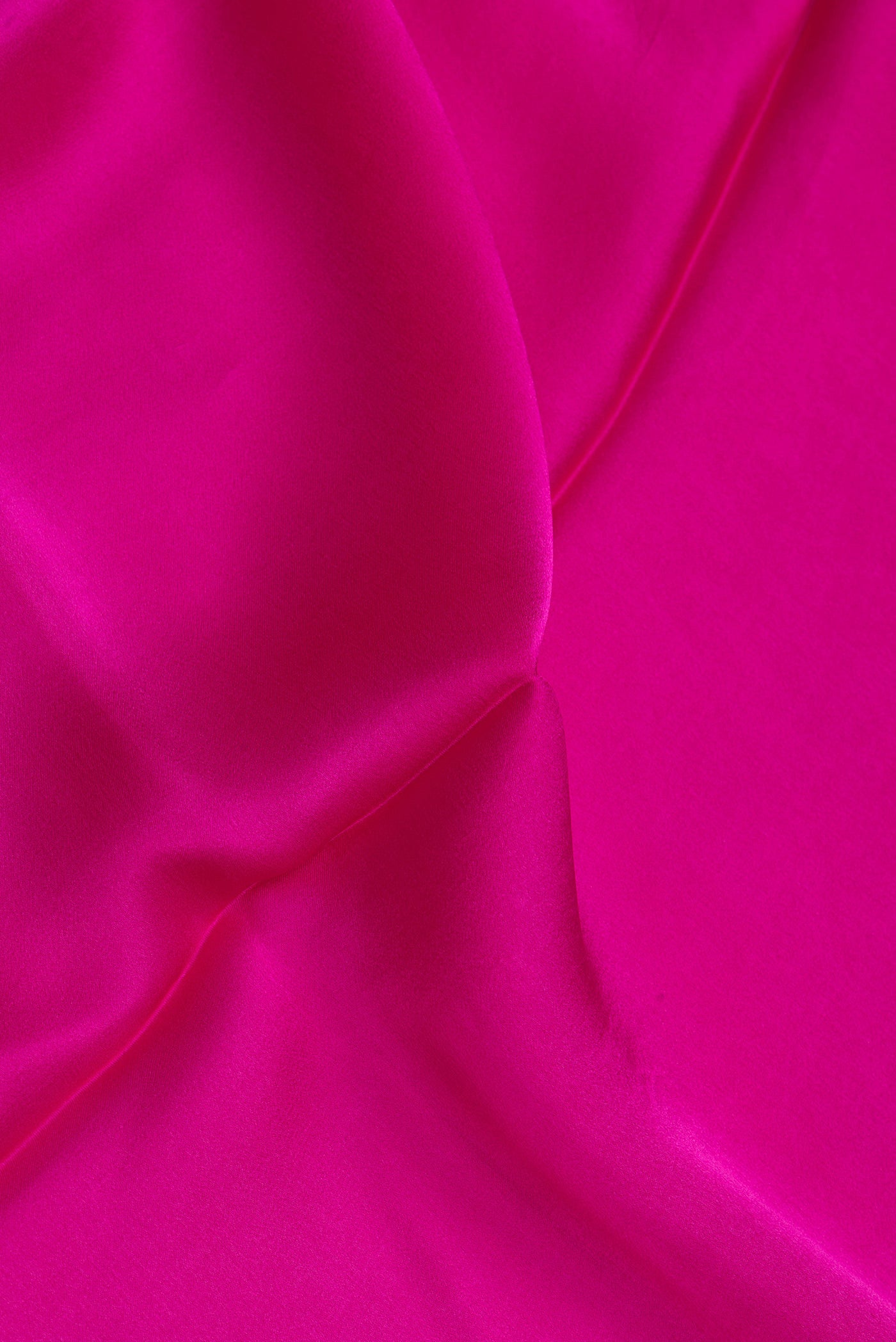 Close up of Dark Pink Crepe Saree with Plain Body and Without Border.  displaying folds