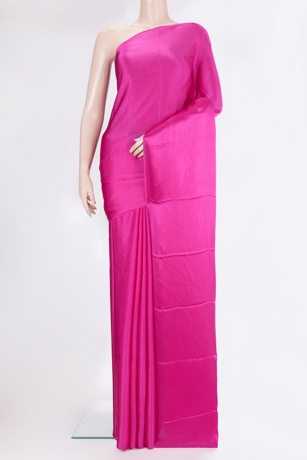 Dark Pink Crepe Saree with Plain Body and Without Border.  displayed on a mannequin