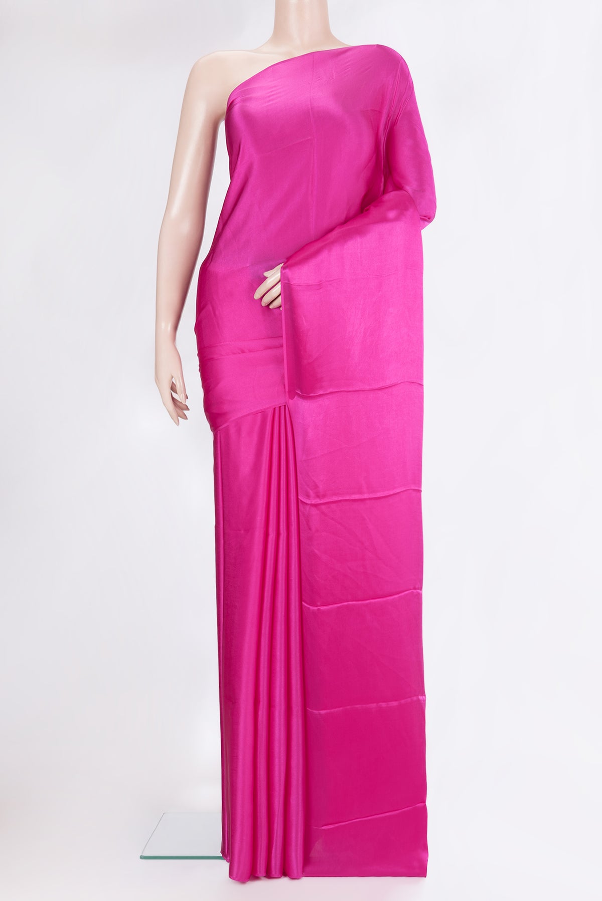 Dark Pink Crepe Saree with Plain Body and Without Border.  displayed on a mannequin