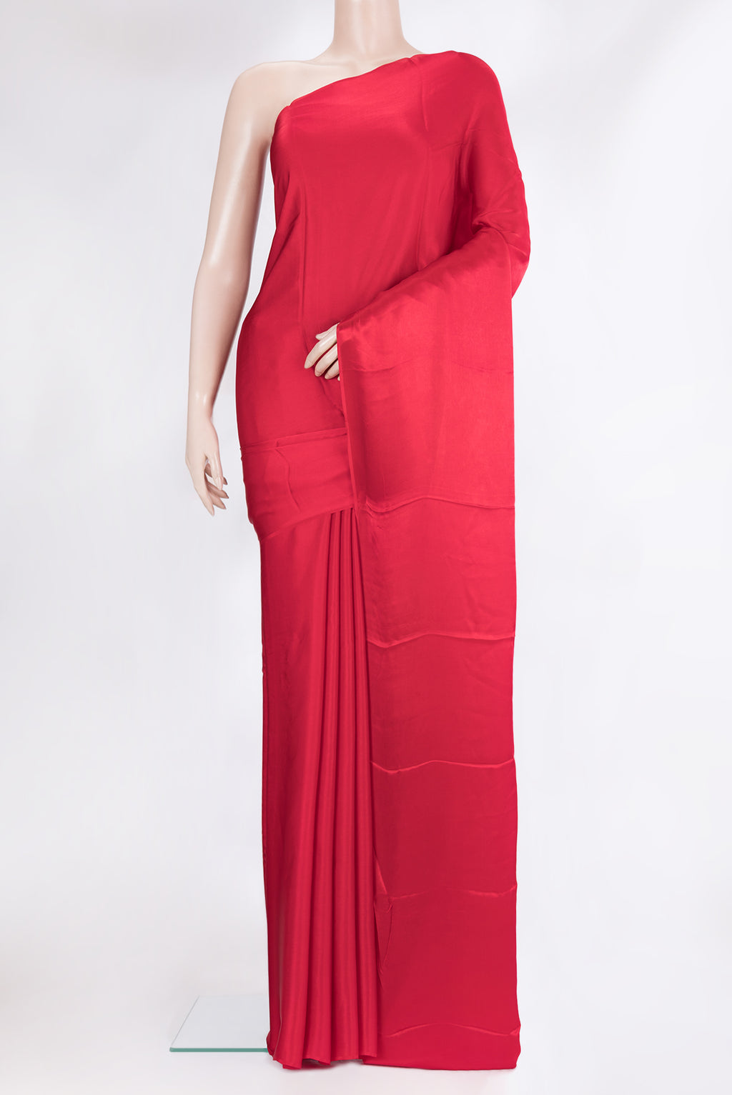Red Crepe Saree with Plain Body and Without Border.  displayed on a mannequin