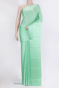 Pista Green Crepe Saree with Plain Body and Without Border.  displayed on a mannequin