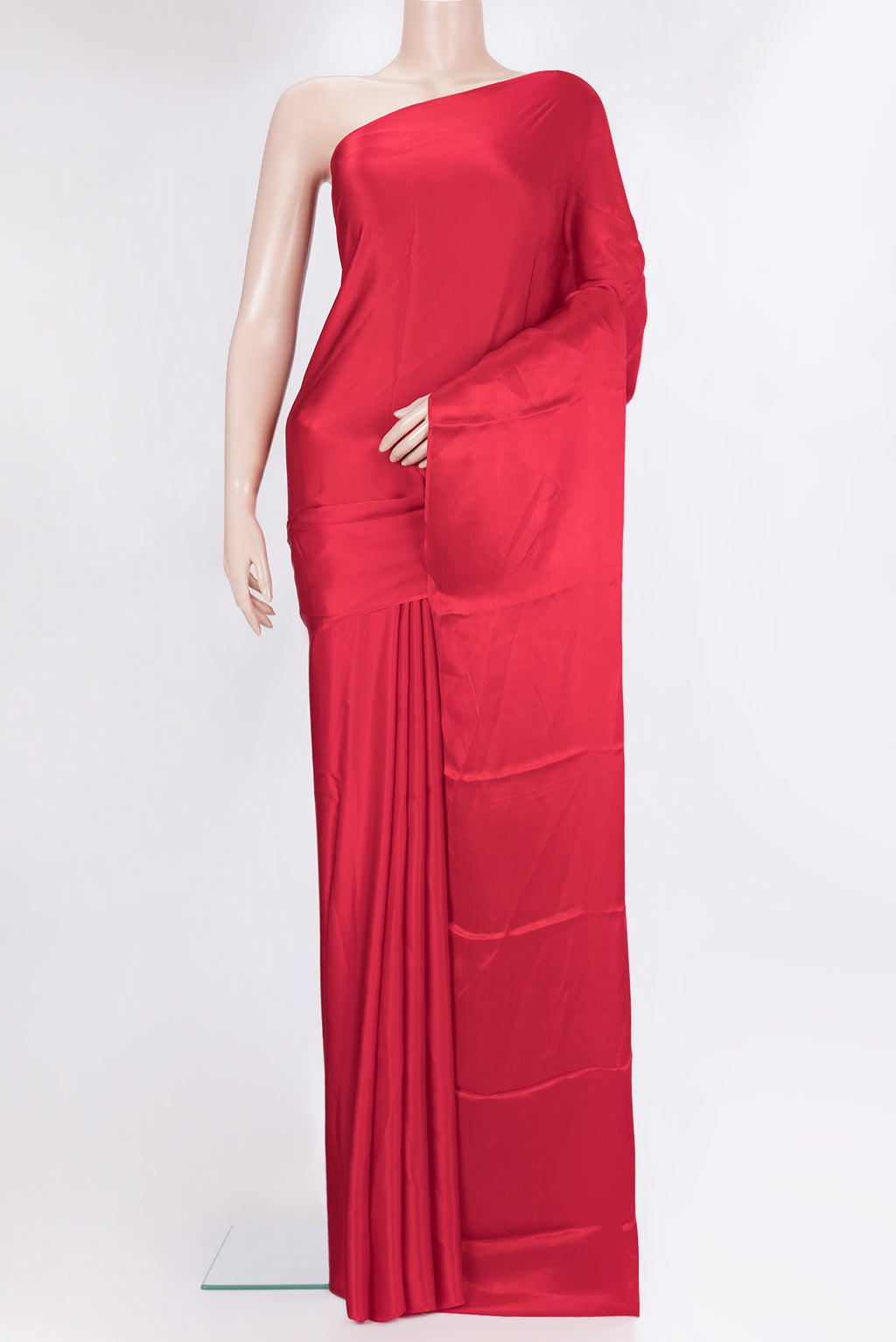 Red Crepe Saree with Plain Body and Without Border.  displayed on a mannequin