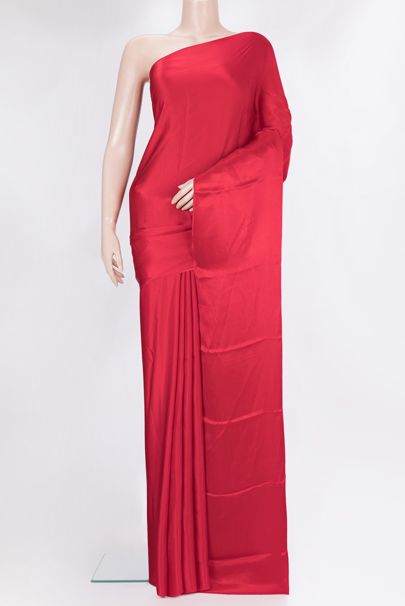 Red Crepe Saree with Plain Body and Without Border.  displayed on a mannequin