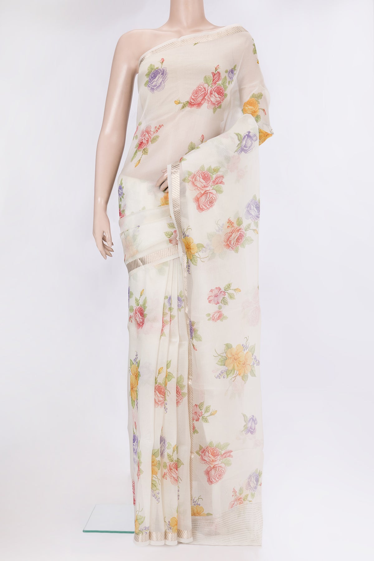 Cream Organza Silk Saree with Floral Print on the body and Zari Border.  displayed on a mannequin