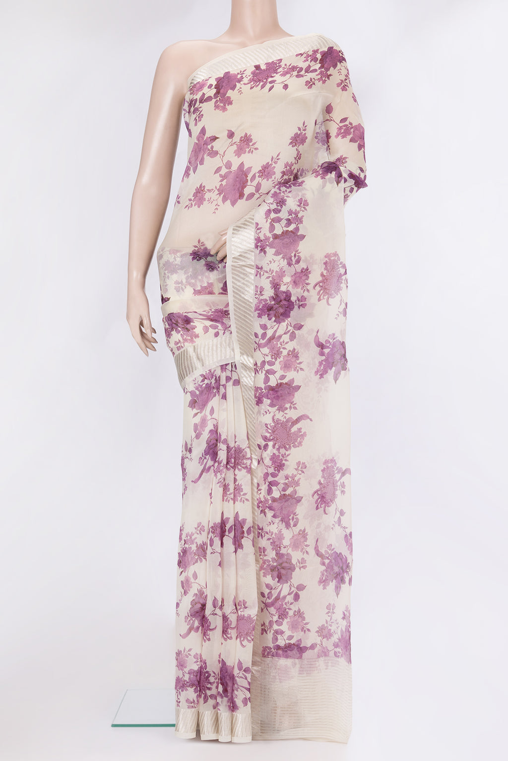Cream Organza Silk Saree with Floral Print on the body and Zari Border.  displayed on a mannequin