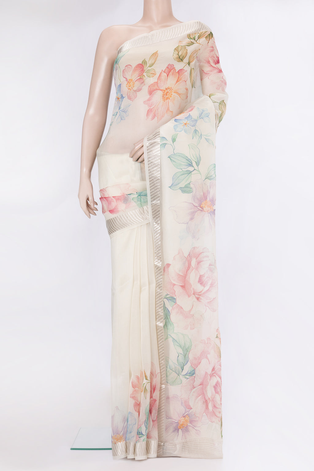 Cream Organza Silk Saree with Floral Print on the body and Zari Border.  displayed on a mannequin