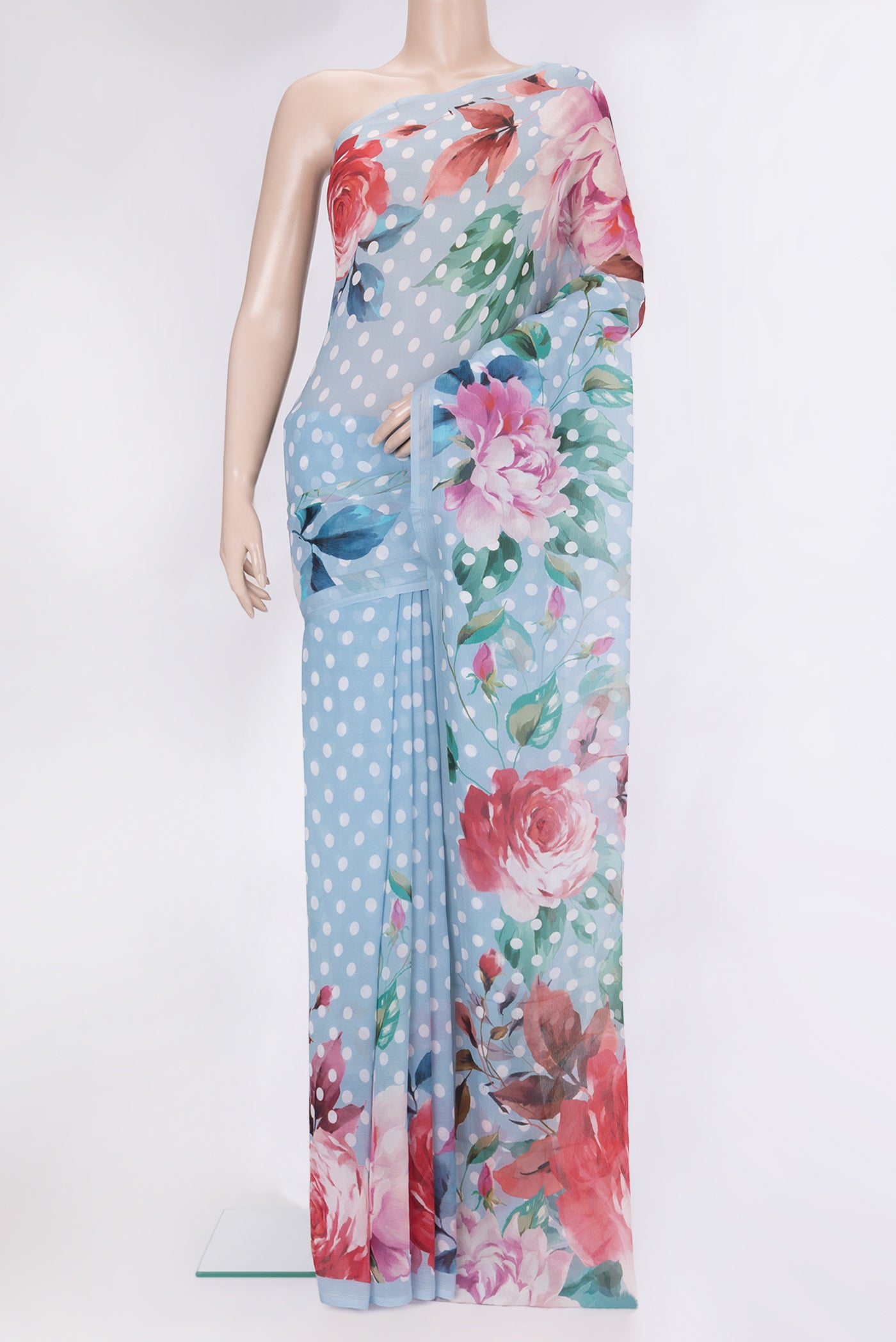 Light Blue Chiffon Saree with Printed design on the body and Without Border.  displayed on a mannequin