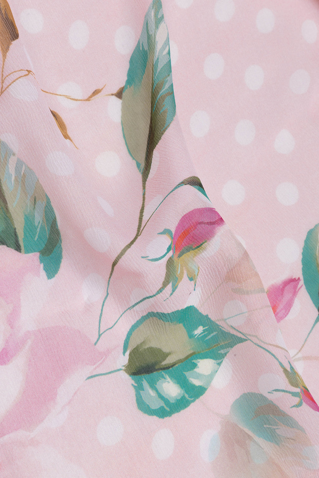Close up of Golden Peach Chiffon Saree with Printed design on the body and Without Border.  displaying folds