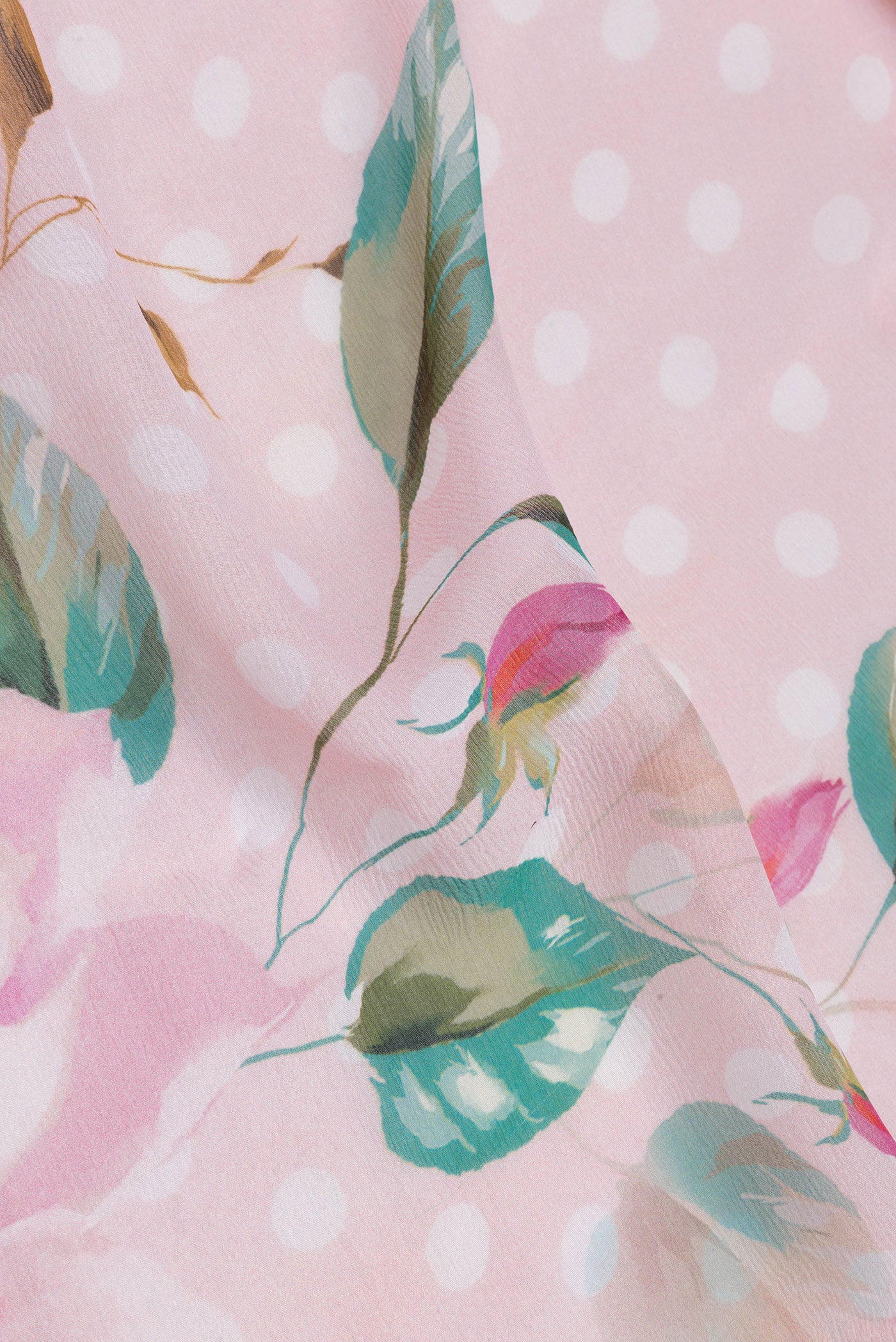 Close up of Golden Peach Chiffon Saree with Printed design on the body and Without Border.  displaying folds