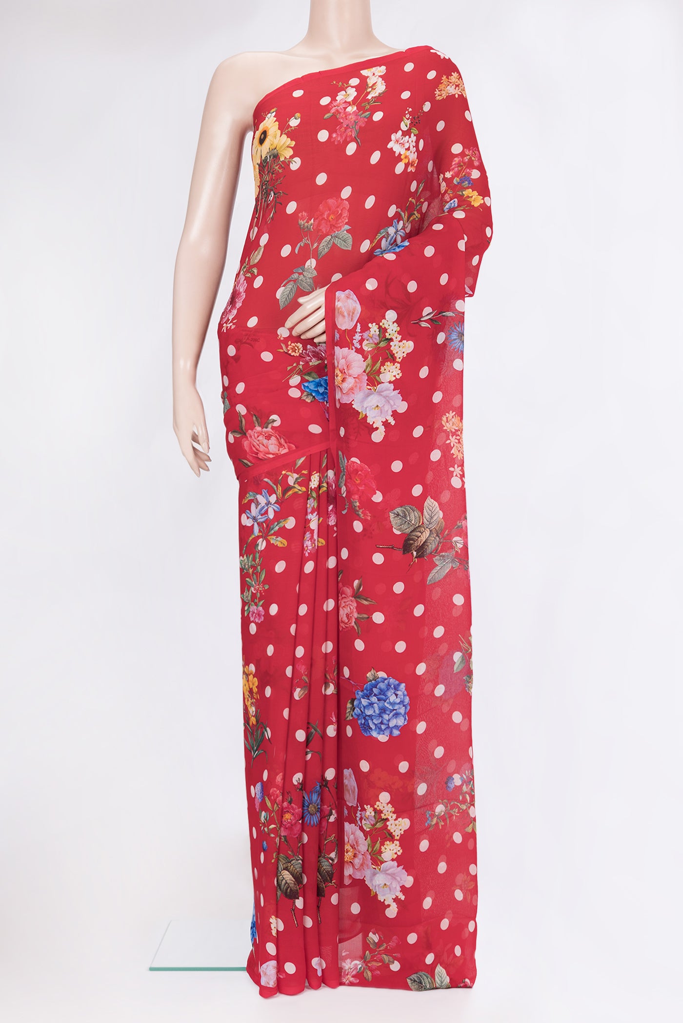 Red Chiffon Saree with Printed design on the body and Without Border.  displayed on a mannequin