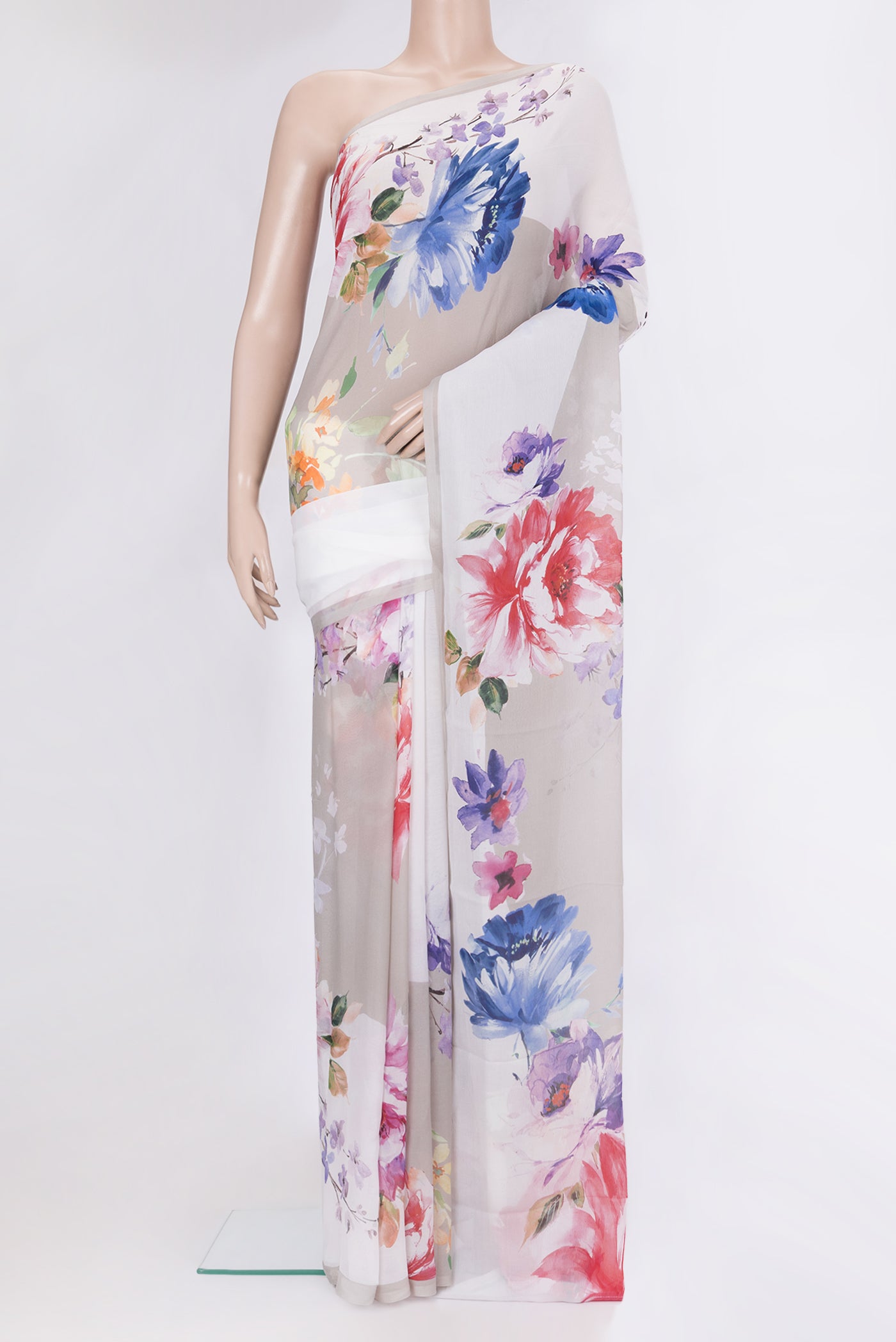 Grey Chiffon Saree with Printed design on the body and Without Border.  displayed on a mannequin