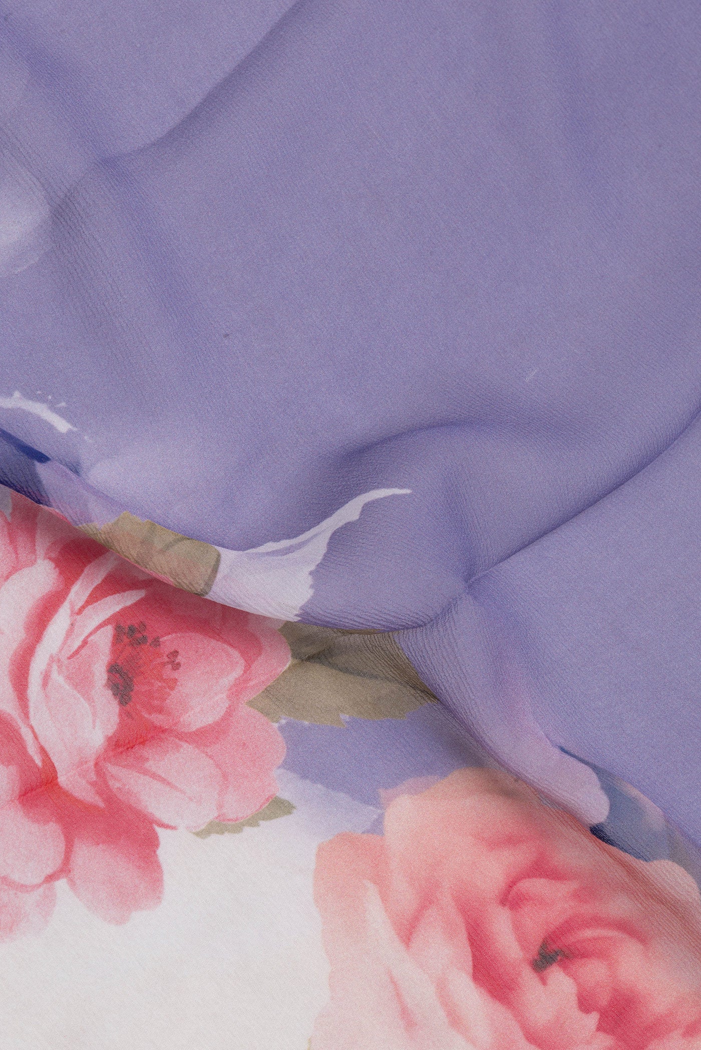 Close up of Lilac Chiffon Saree with Plain Body and Printed Border.  displaying folds