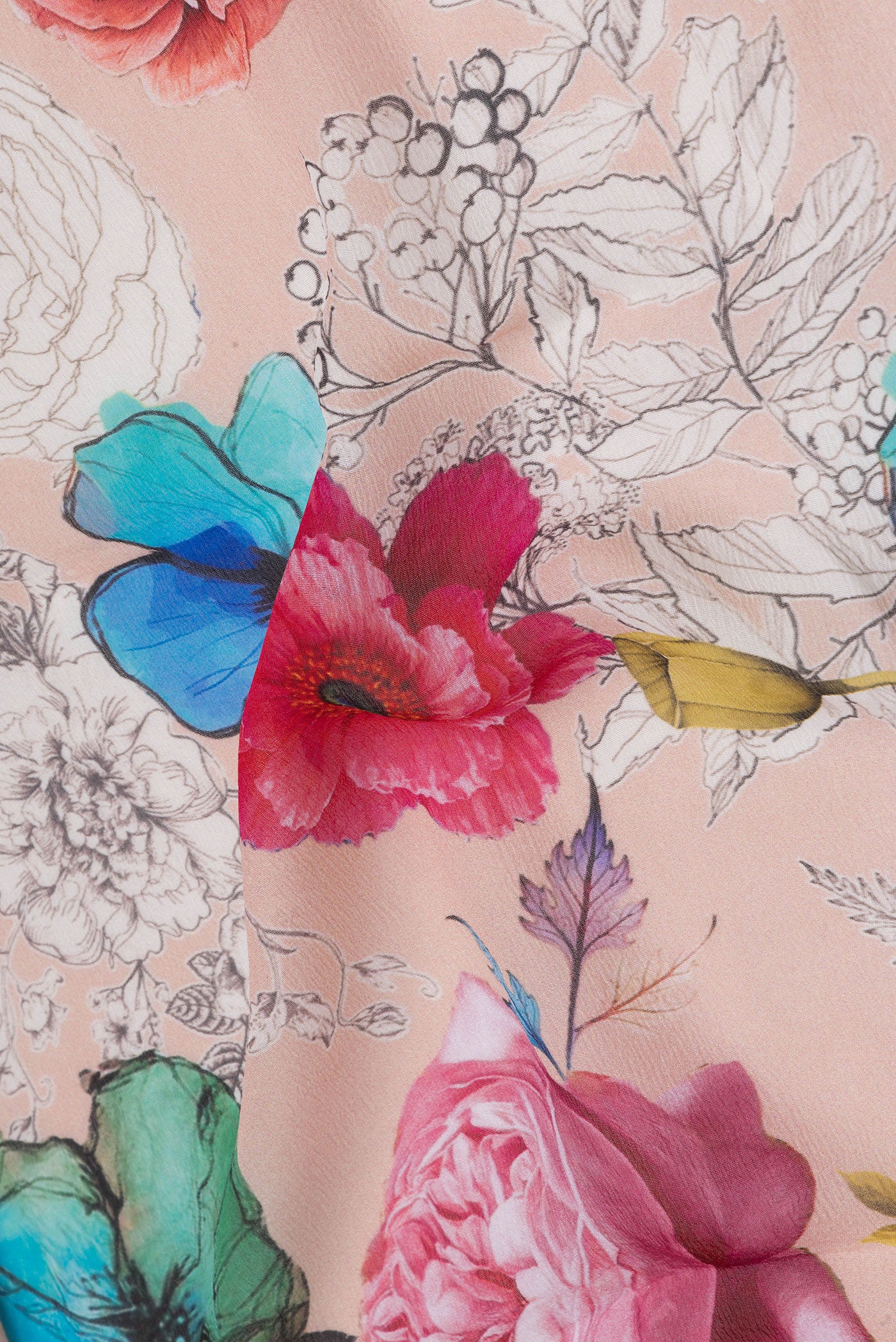 Close up of Peach Chiffon Saree with Printed design on the body and Without Border.  displaying folds
