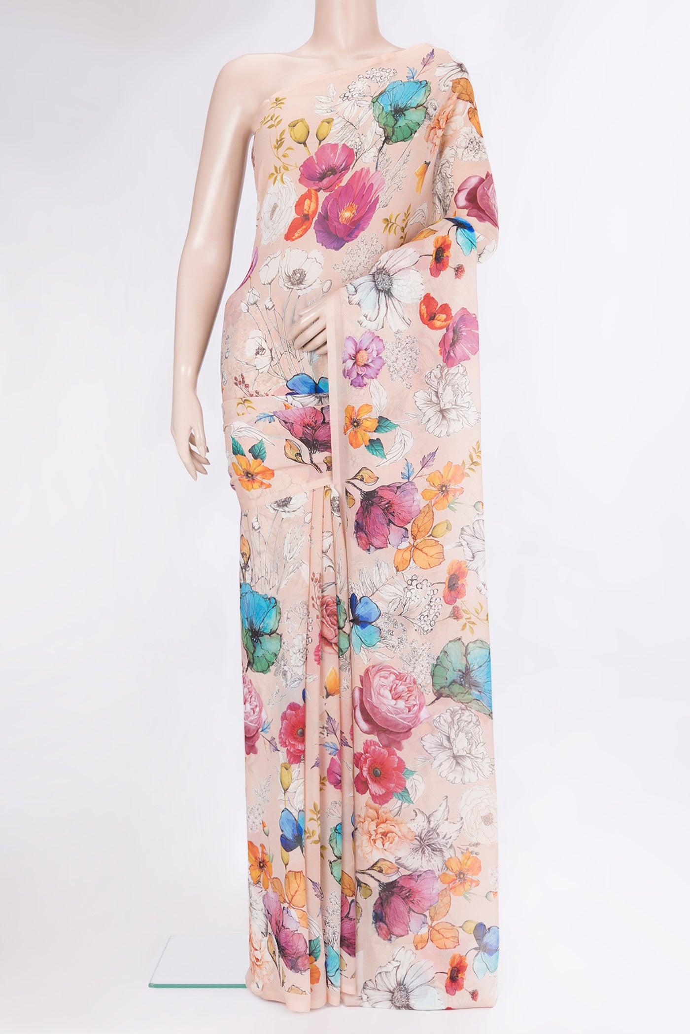 Peach Chiffon Saree with Printed design on the body and Without Border.  displayed on a mannequin