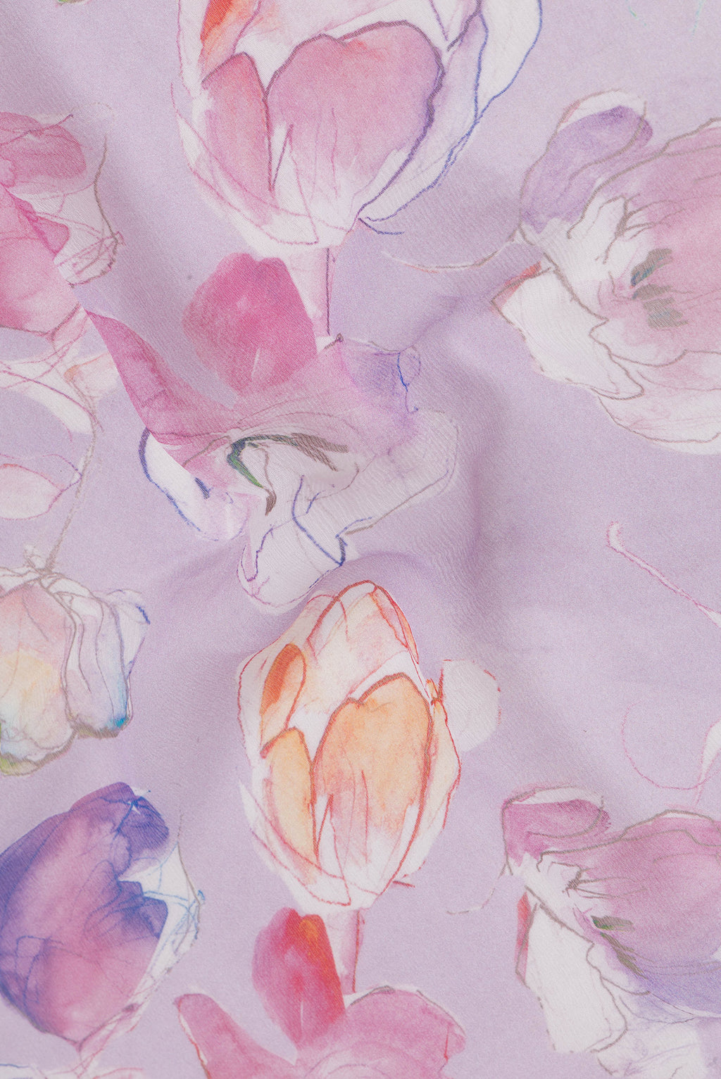 Close up of Lavender Chiffon Saree with Floral Print on the body and Zari Border.  displaying folds