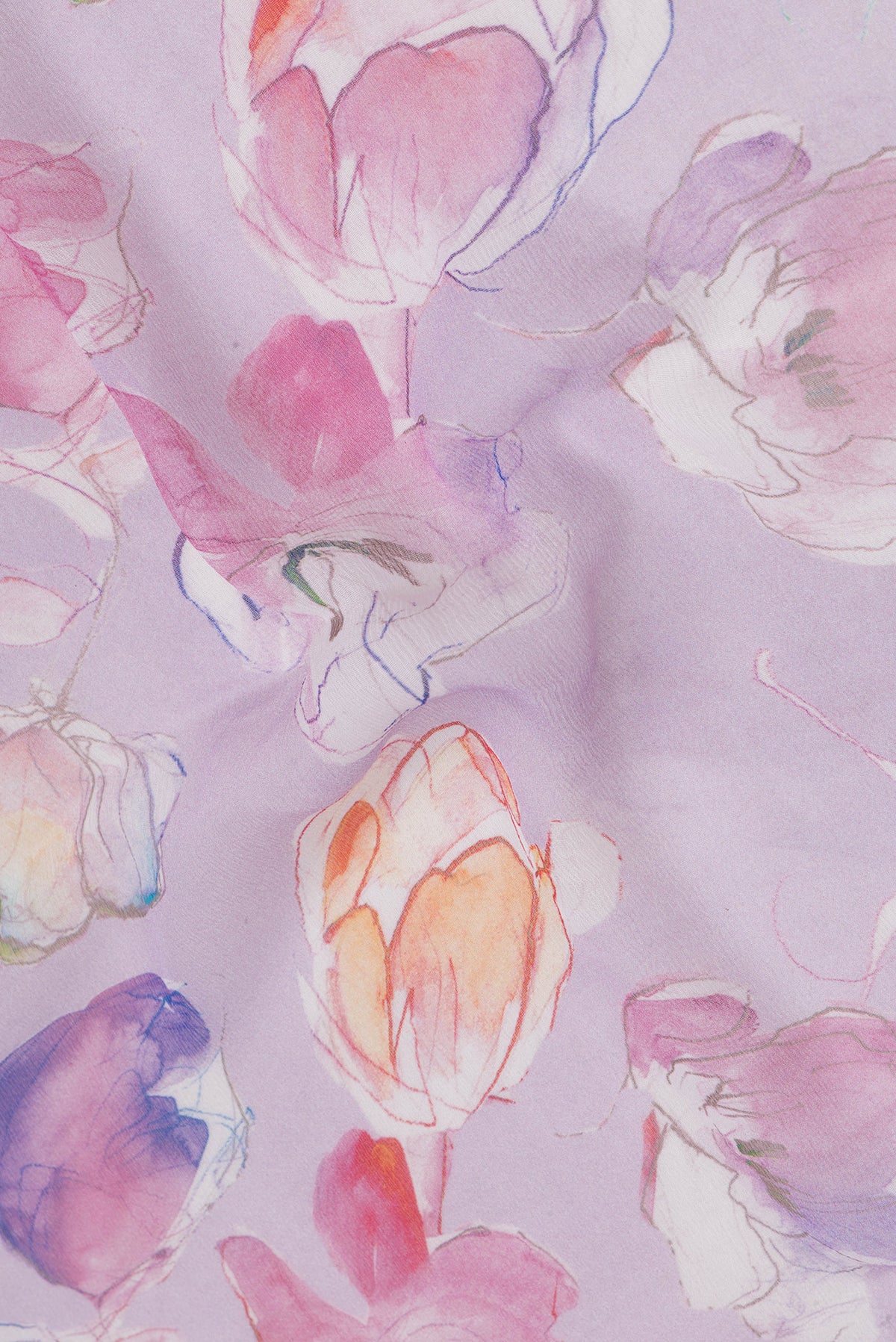 Close up of Lavender Chiffon Saree with Floral Print on the body and Zari Border.  displaying folds
