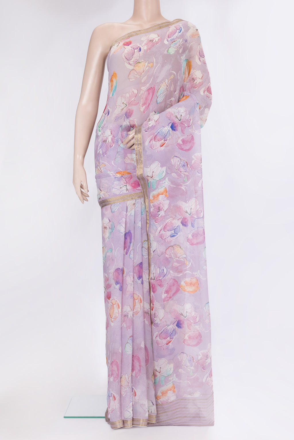 Lavender Chiffon Saree with Floral Print on the body and Zari Border.  displayed on a mannequin