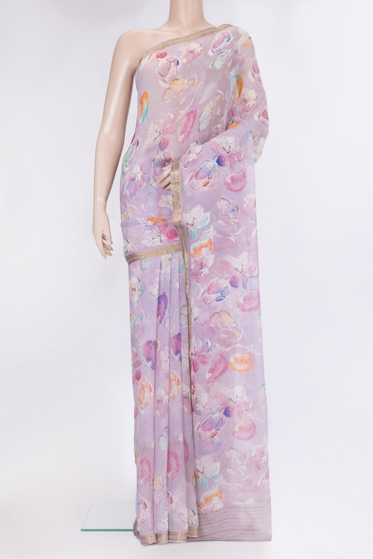 Lavender Chiffon Saree with Floral Print on the body and Zari Border.  displayed on a mannequin