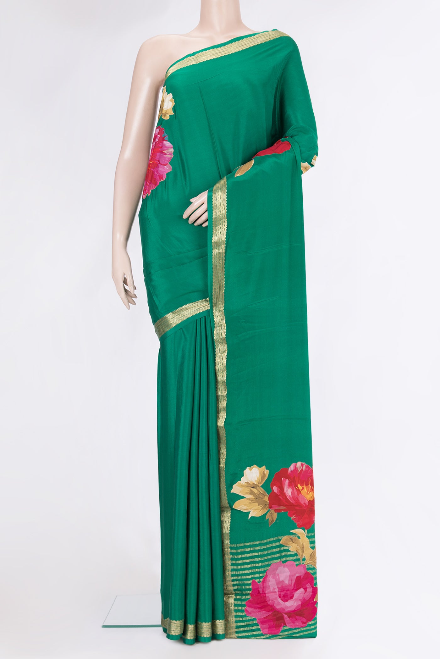 Green Crepe Saree with Plain Body and Zari Border.  displayed on a mannequin