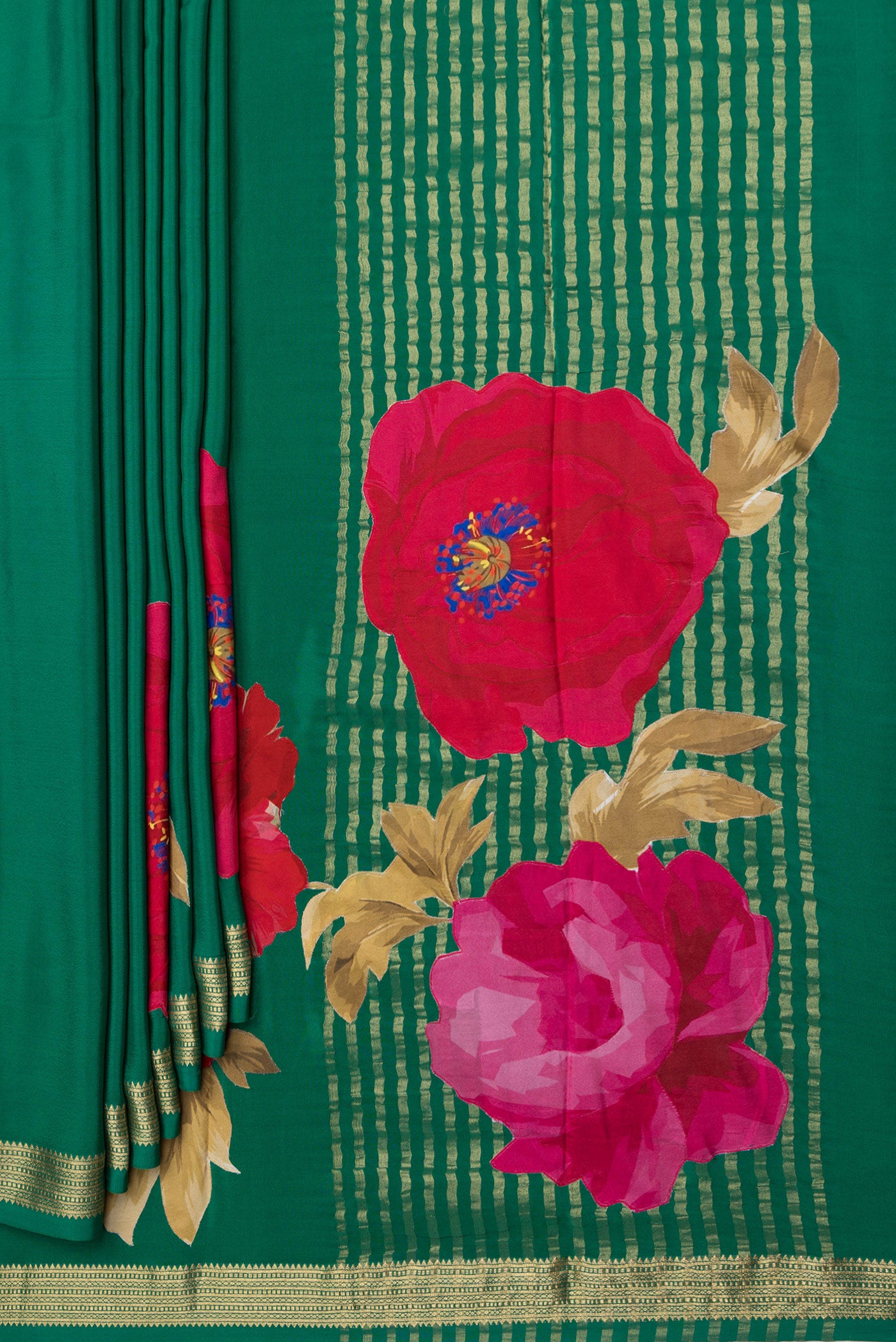 Pleats and pallu of Green Crepe Saree with Plain Body and Zari Border. 