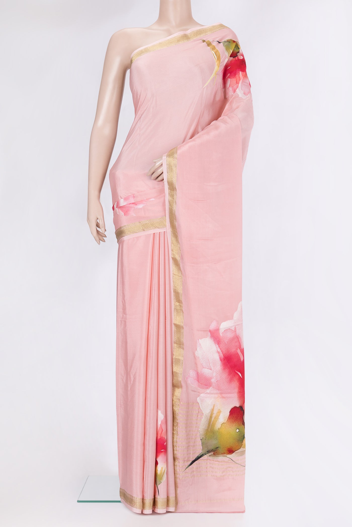 Rose pink Crepe Saree with Plain Body and Zari Border.  displayed on a mannequin