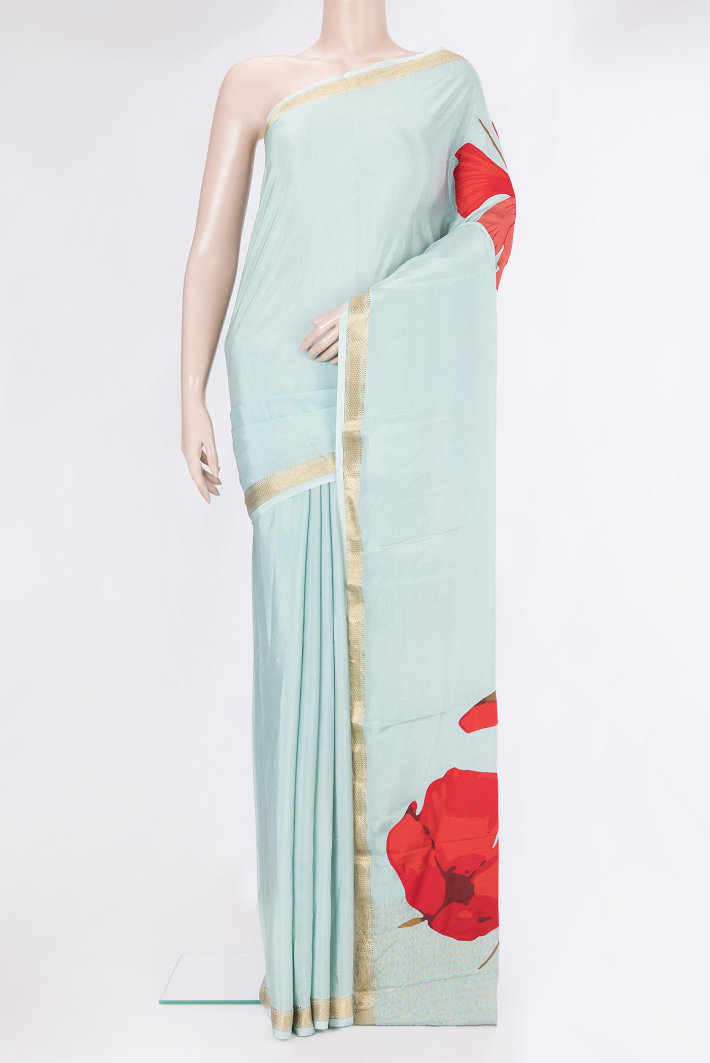 Sky Blue Crepe Saree with Plain Body and Zari Border.  displayed on a mannequin