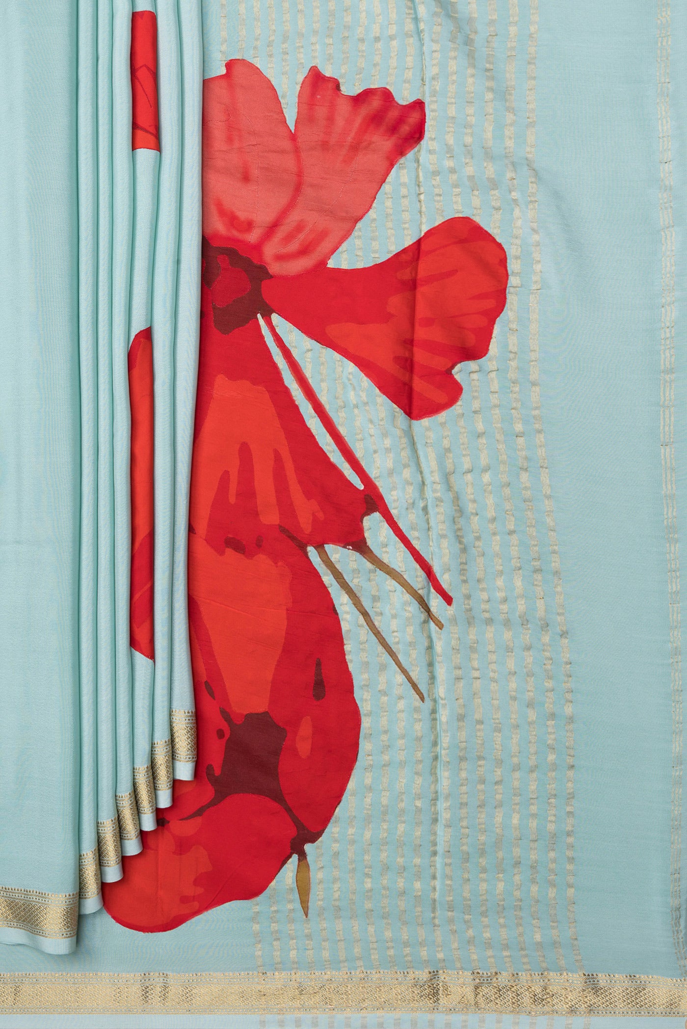 Pleats and pallu of Sky Blue Crepe Saree with Plain Body and Zari Border. 