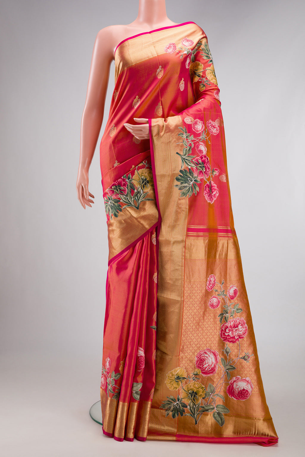 Coral Dual Tone Kanjivaram Silk Saree with Zari Butta on the body and Fancy Border.  displayed on a mannequin