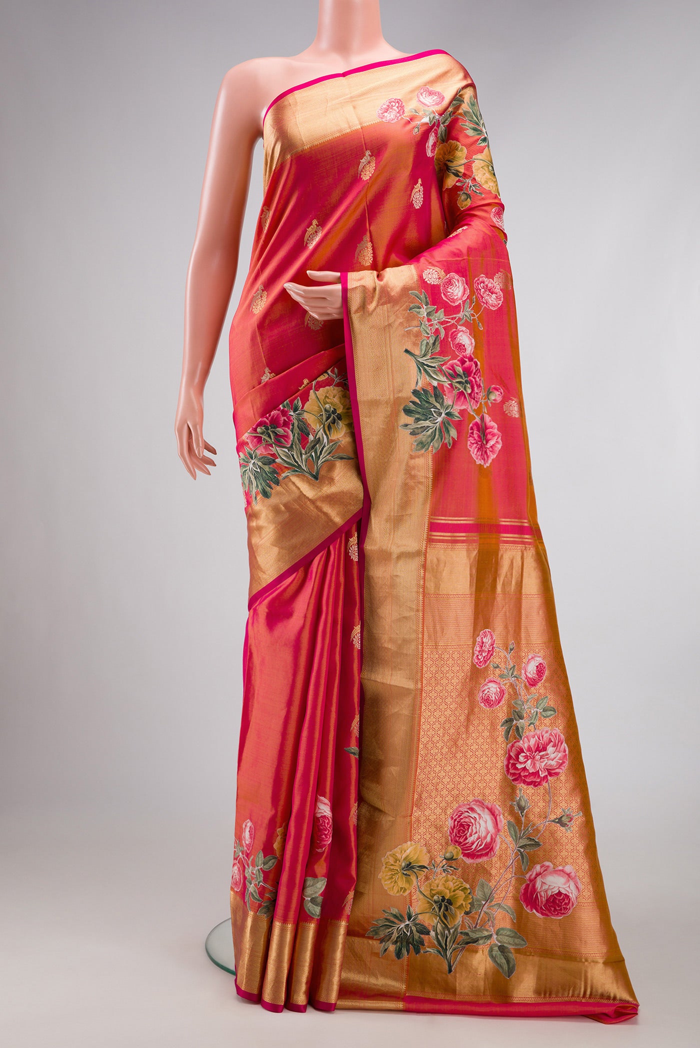 Coral Dual Tone Kanjivaram Silk Saree with Zari Butta on the body and Fancy Border.  displayed on a mannequin