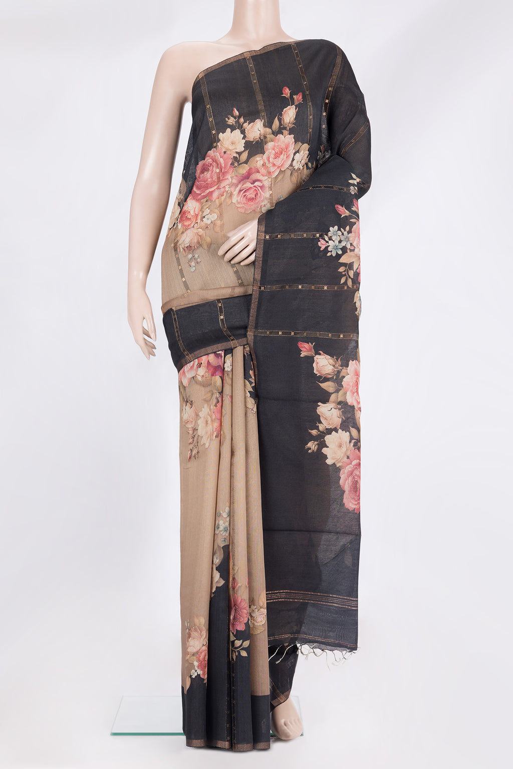 Brown Tussar Saree with Embroidery on the body and Zari Border.  displayed on a mannequin