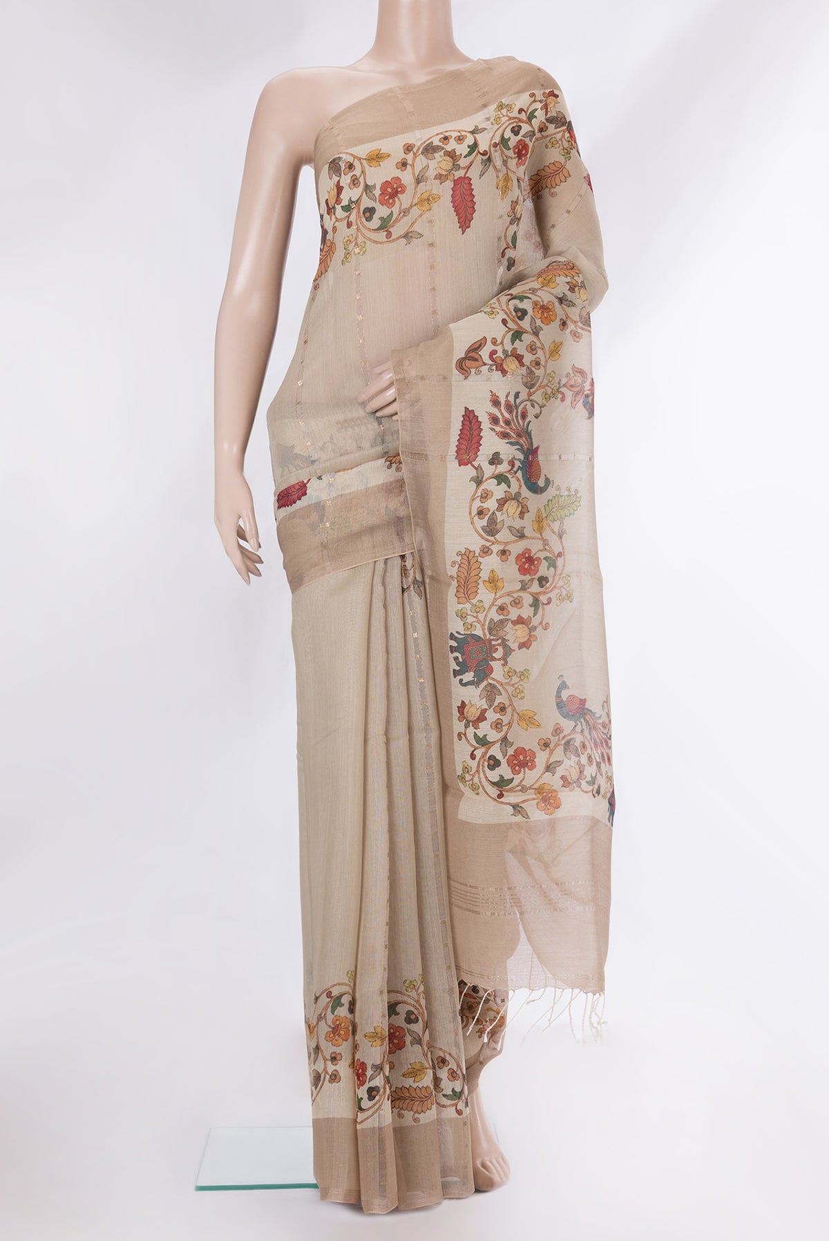 Pure Silk Beige Dual Tone Tussar Saree with Embroidery on the body and Fancy Border.  displayed on a mannequin