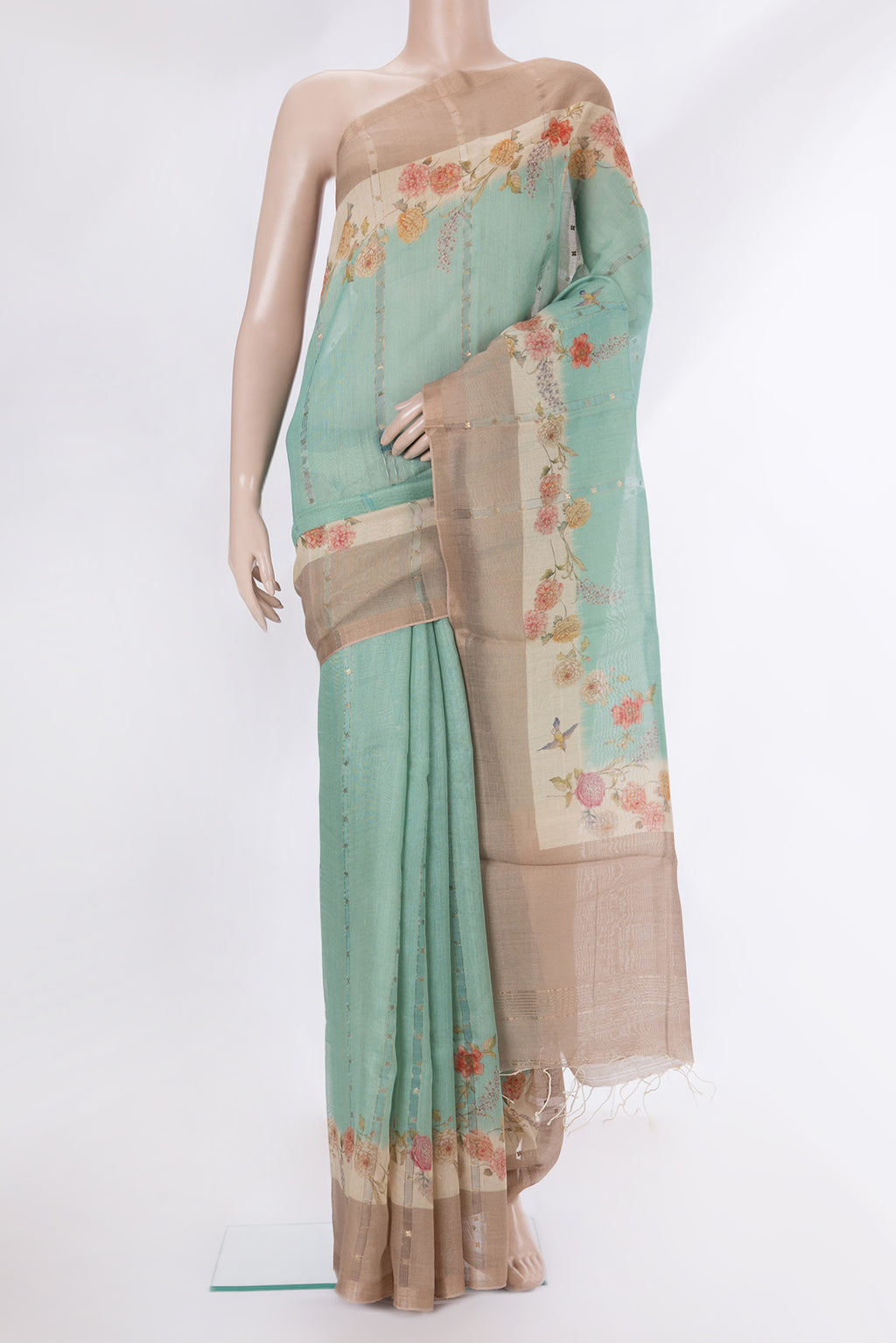 Pure Silk Light Green Dual Tone Tussar Saree with Embroidery on the body and Fancy Border.  displayed on a mannequin